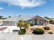 Charming single-story home featuring a tiled roof, landscaped front yard, and inviting curb appeal at 3241 E Winery Rd, Pahrump, NV 89048