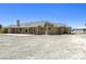 Spacious home exterior showing large lot, tiled roof, back porch, and potential for outdoor activities at 3241 E Winery Rd, Pahrump, NV 89048