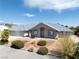 Inviting single-story home with meticulous landscaping and a charming entrance, perfect for curb appeal at 3241 E Winery Rd, Pahrump, NV 89048