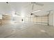 Spacious three-car garage with multiple ceiling fans and ample storage at 3241 E Winery Rd, Pahrump, NV 89048