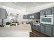 Modern kitchen featuring gray cabinetry, stainless steel appliances, and a bright, open layout at 3241 E Winery Rd, Pahrump, NV 89048