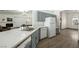 Stylish kitchen with quartz countertops, gray cabinets, stainless steel sink, and stainless steel appliances at 3241 E Winery Rd, Pahrump, NV 89048
