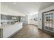 Bright kitchen features modern appliances, ample counter space, and wood laminate flooring at 3241 E Winery Rd, Pahrump, NV 89048
