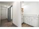 Well-lit laundry room with custom storage and sink at 3241 E Winery Rd, Pahrump, NV 89048