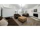 Spacious living room with recessed lighting, modern fireplace, and access to kitchen at 3241 E Winery Rd, Pahrump, NV 89048