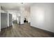 Bright living room features wood floors, modern lighting and neutral paint palette at 3241 E Winery Rd, Pahrump, NV 89048