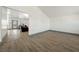 Spacious living room showcasing an open layout, wood-look flooring, and neutral paint at 3241 E Winery Rd, Pahrump, NV 89048