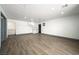 Spacious living area boasts grey trim, light wood floors, and built-in cabinets at 3241 E Winery Rd, Pahrump, NV 89048