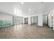 Open living area with wood floors, recessed lights, and multiple doorways to adjoining rooms at 3241 E Winery Rd, Pahrump, NV 89048