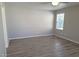 A bright and airy bedroom with neutral walls and wood-look floors, providing a blank canvas at 3617 Austell St, Las Vegas, NV 89129