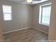 A comfortable bedroom with natural light, and wood-look floors, creating a cozy retreat at 3617 Austell St, Las Vegas, NV 89129