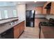 A kitchen with stainless steel appliances, wooden cabinets, and an island, perfect for cooking at 3617 Austell St, Las Vegas, NV 89129