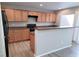 Well-equipped kitchen featuring wooden cabinetry, modern appliances, and a breakfast bar at 3617 Austell St, Las Vegas, NV 89129