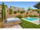 Beautiful backyard with a hot tub, pool, water feature, and lush landscaping at 391 Capistrano Vistas St, Las Vegas, NV 89138