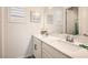 Bright bathroom featuring double sinks with white marble countertops and decor accents at 391 Capistrano Vistas St, Las Vegas, NV 89138