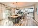 Bright dining area and a view to the modern kitchen featuring granite countertops at 391 Capistrano Vistas St, Las Vegas, NV 89138