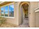 Inviting arched entryway with brick-paved walkway leading to the front door at 391 Capistrano Vistas St, Las Vegas, NV 89138