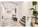 Welcoming foyer with hardwood floors, staircase, and stylish decor at 391 Capistrano Vistas St, Las Vegas, NV 89138