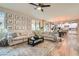 Spacious living room with open floor plan, hardwood floors and comfortable seating at 391 Capistrano Vistas St, Las Vegas, NV 89138