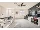 Open loft area featuring a comfortable sofa, built in shelves and desk, and plenty of natural light at 391 Capistrano Vistas St, Las Vegas, NV 89138