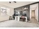 Bright office space featuring a gray accent wall, white desks, and shelves for decor and monitors at 391 Capistrano Vistas St, Las Vegas, NV 89138