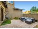 Relaxing outdoor patio with stylish furniture and a cozy hanging chair at 391 Capistrano Vistas St, Las Vegas, NV 89138