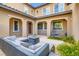 Relaxing outdoor patio with stylish furniture and a cozy hanging chair at 391 Capistrano Vistas St, Las Vegas, NV 89138