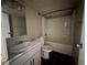 Updated bathroom featuring a shower-tub combo, and vanity with marbled countertop at 3930 University Center Dr # 901, Las Vegas, NV 89119