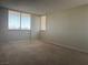 Spacious bedroom with large windows offering a view at 3930 University Center Dr # 901, Las Vegas, NV 89119