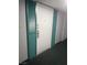 Apartment front door flanked with teal colored shutters at 3930 University Center Dr # 901, Las Vegas, NV 89119