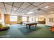 Game room with billiard tables, comfortable seating and ambient lighting for residents at 3930 University Center Dr # 901, Las Vegas, NV 89119