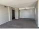 Large, open-concept living area with neutral paint and carpeting at 3930 University Center Dr # 901, Las Vegas, NV 89119