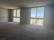 Spacious living room featuring large windows that let in plenty of natural light at 3930 University Center Dr # 901, Las Vegas, NV 89119