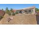Low maintenance backyard featuring a rock garden surrounding a desert landscaped yard at 4029 Ricebird Way, North Las Vegas, NV 89084