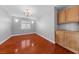 Bedroom featuring hardwood floors, built-in shelving, and modern lighting fixtures at 4029 Ricebird Way, North Las Vegas, NV 89084