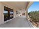 View of a covered patio that includes a ceiling fan, sliding glass doors and concrete flooring at 4029 Ricebird Way, North Las Vegas, NV 89084