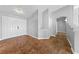 Spacious living room with neutral colors, tile flooring, and access to other rooms in the home at 4029 Ricebird Way, North Las Vegas, NV 89084