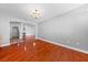 Living room features hardwood floors, light gray walls, and a fireplace at 4029 Ricebird Way, North Las Vegas, NV 89084