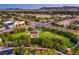 Overhead view features a park with lake, playground, gazebo, and trees within a vibrant residential community at 4045 Abernethy Forest Pl, Las Vegas, NV 89141