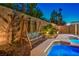Inviting backyard featuring a cozy swing and a refreshing pool at 4045 Abernethy Forest Pl, Las Vegas, NV 89141