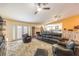 A spacious living room with hardwood floors, an area rug, and adjacent kitchen at 4095 Ridgewood Ave, Las Vegas, NV 89120