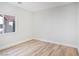 Well-lit bedroom with hardwood floors, offering a cozy and inviting space for relaxation at 4314 Livorno Ave, Las Vegas, NV 89141