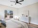 Bright bedroom features a window with a view to a hot tub and simple, modern decor at 4314 Livorno Ave, Las Vegas, NV 89141
