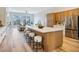 Spacious open-concept kitchen with a large island, seating, and views of the living room at 4314 Livorno Ave, Las Vegas, NV 89141