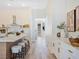 Bright kitchen with a large island, modern stools, and a tile backsplash at 4314 Livorno Ave, Las Vegas, NV 89141