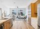 Open-concept living space featuring a kitchen, living room, and backyard access at 4314 Livorno Ave, Las Vegas, NV 89141
