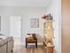 Comfortable living room featuring a cozy chair and stylish bookshelf at 4314 Livorno Ave, Las Vegas, NV 89141