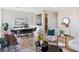 Bright living room featuring modern furnishings and an open-concept design with wood flooring at 4314 Livorno Ave, Las Vegas, NV 89141