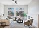 Bright living room boasts modern furnishings, fireplace, and natural light from large windows at 4314 Livorno Ave, Las Vegas, NV 89141