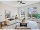 Bright living room with a modern design, neutral colors, and access to the backyard at 4314 Livorno Ave, Las Vegas, NV 89141